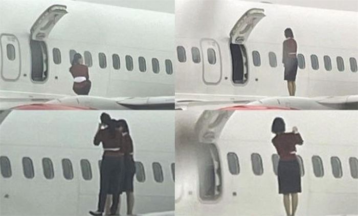 ลูกเรือยืนถ่ายรูปบนปีกเครื่องบิน ลูกเรือยืนถ่ายรูปบนปีกเครื่องบิน