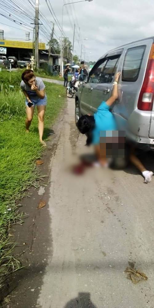 สาวติดบังโคลนล้อรถยนต์