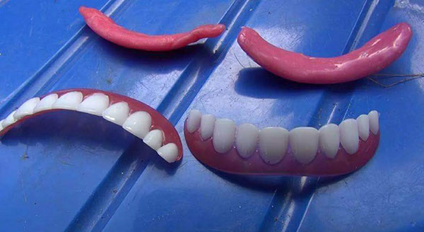 หลอกขายฟันปลอม