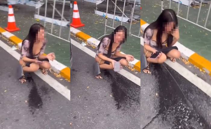 สาวนั่งฉี่หน้าโรงพัก