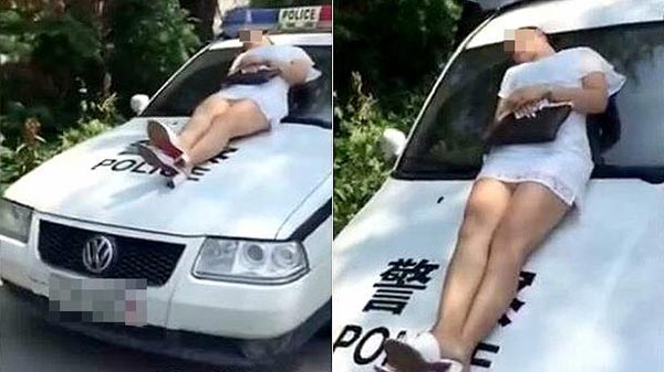 แกล้งหลับบนกระโปรงรถตำรวจ