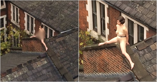 มันคือศิลปะ !? สาวแก้ผ้าอล่างฉ่างนั่งคร่อมหลังคาตึกนานกว่า 4 ชั่วโมง